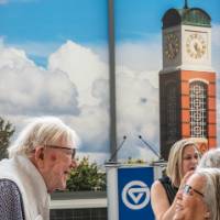 President Emeritus Don Lubbers speaking with woman at event